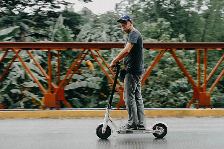 adult man on electric scooter