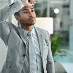 Man frustrated thinking at office with stress fail and regret