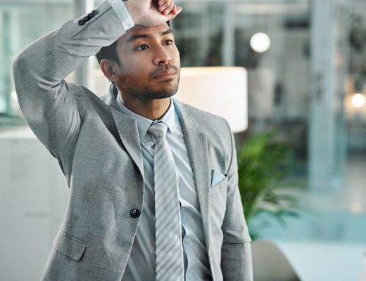 Man frustrated thinking at office with stress fail and regret